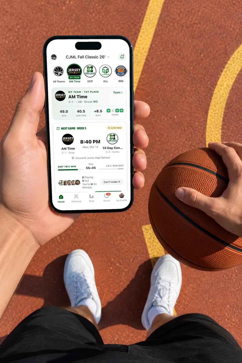 Player holding an iPhone showing the GameGrid league home on a court